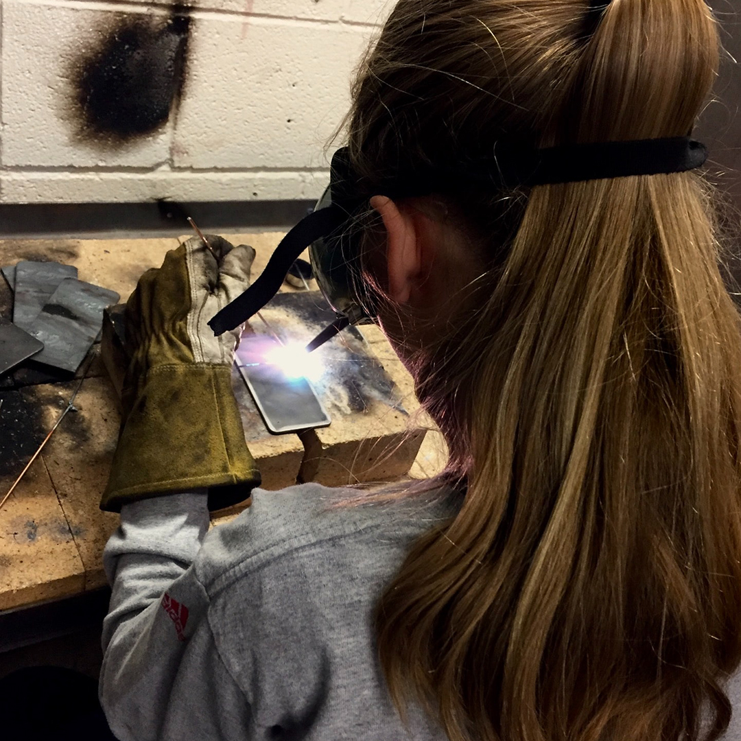 young female welder